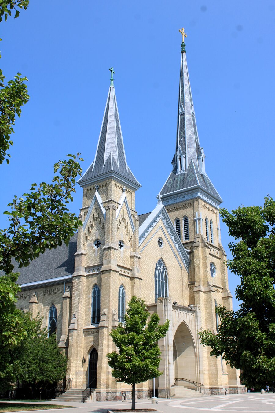 St. Andrew's Cathedral in Grand Rapids, its twin spires rising against a blue sky